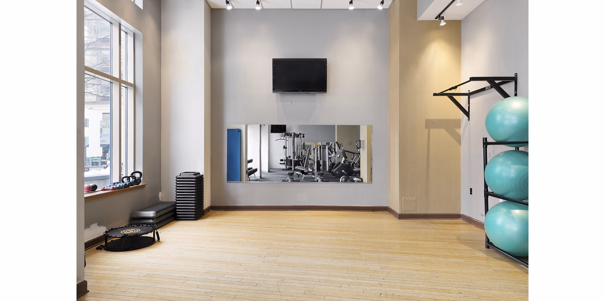 Modern fitness center with state-of-the-art equipment at SoCam 290 Apartments