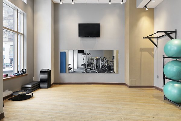 Modern fitness center with state-of-the-art equipment at SoCam 290 Apartments