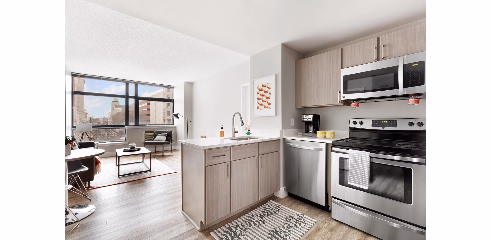 Modern kitchen with stainless steel appliances at SoCam 290 Apartments
