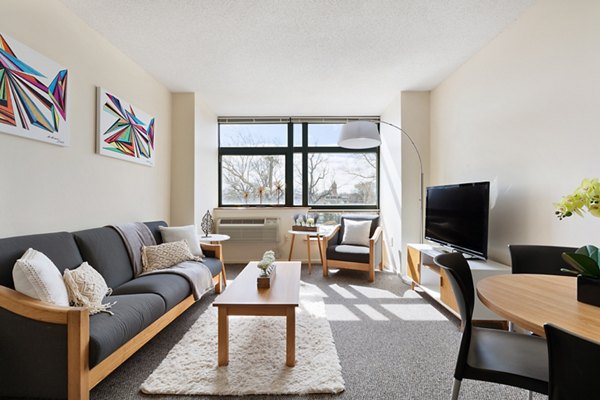 Spacious living room with modern decor in SoCam 290 Apartments, Greystar luxury apartments