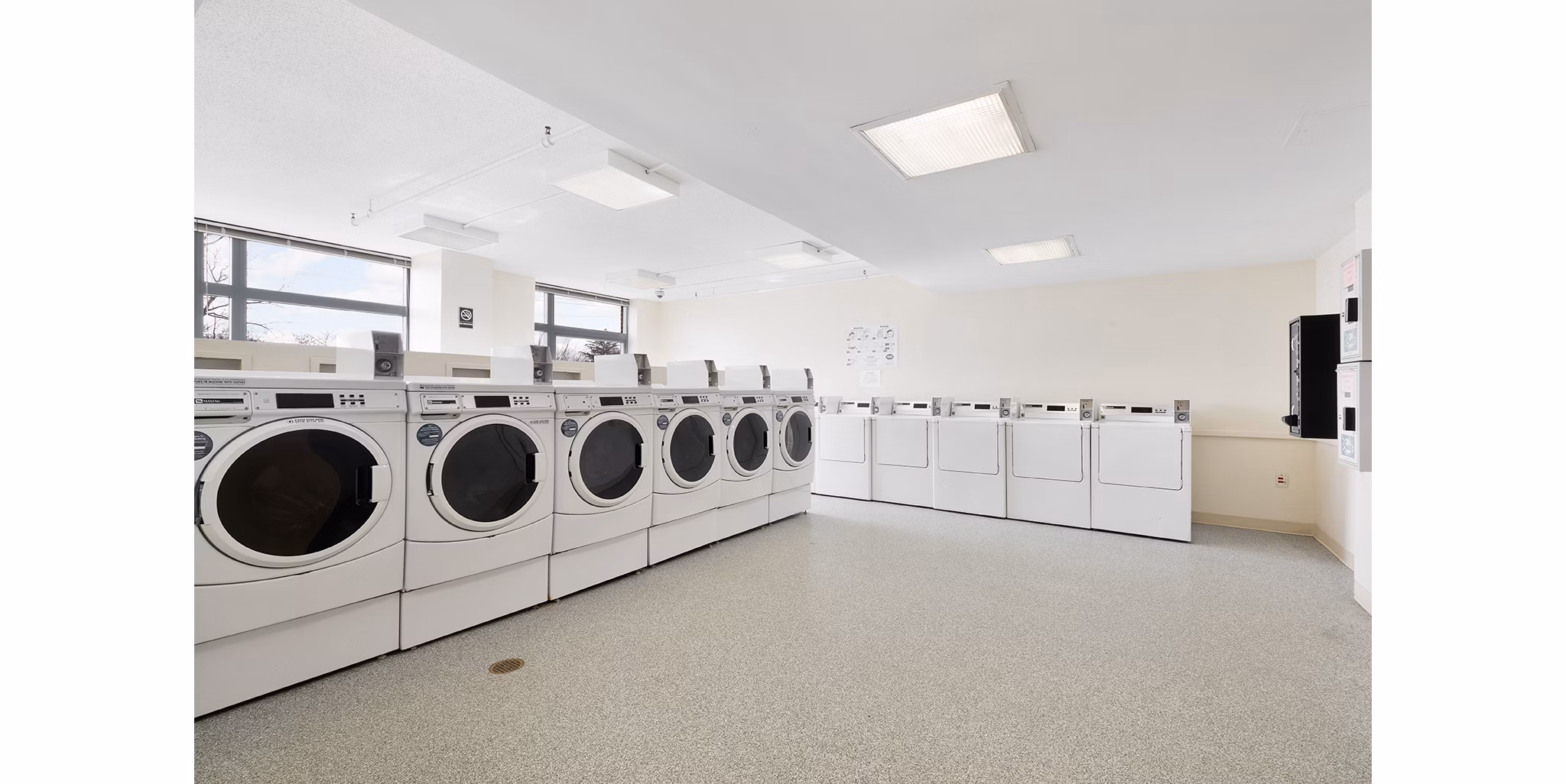 Convenient laundry center at SoCam 290 Apartments offers top-notch facilities for residents of luxury apartments by Greystar