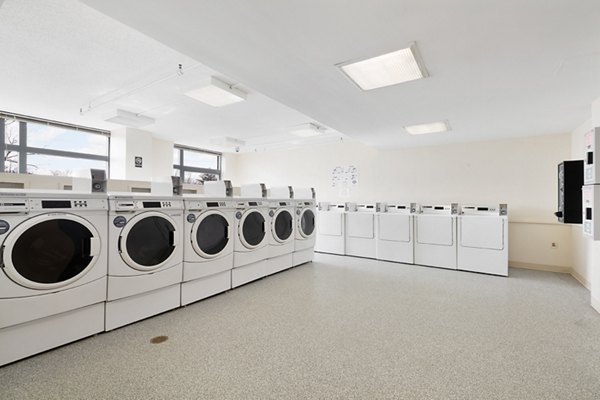 Convenient laundry center at SoCam 290 Apartments offers top-notch facilities for residents of luxury apartments by Greystar