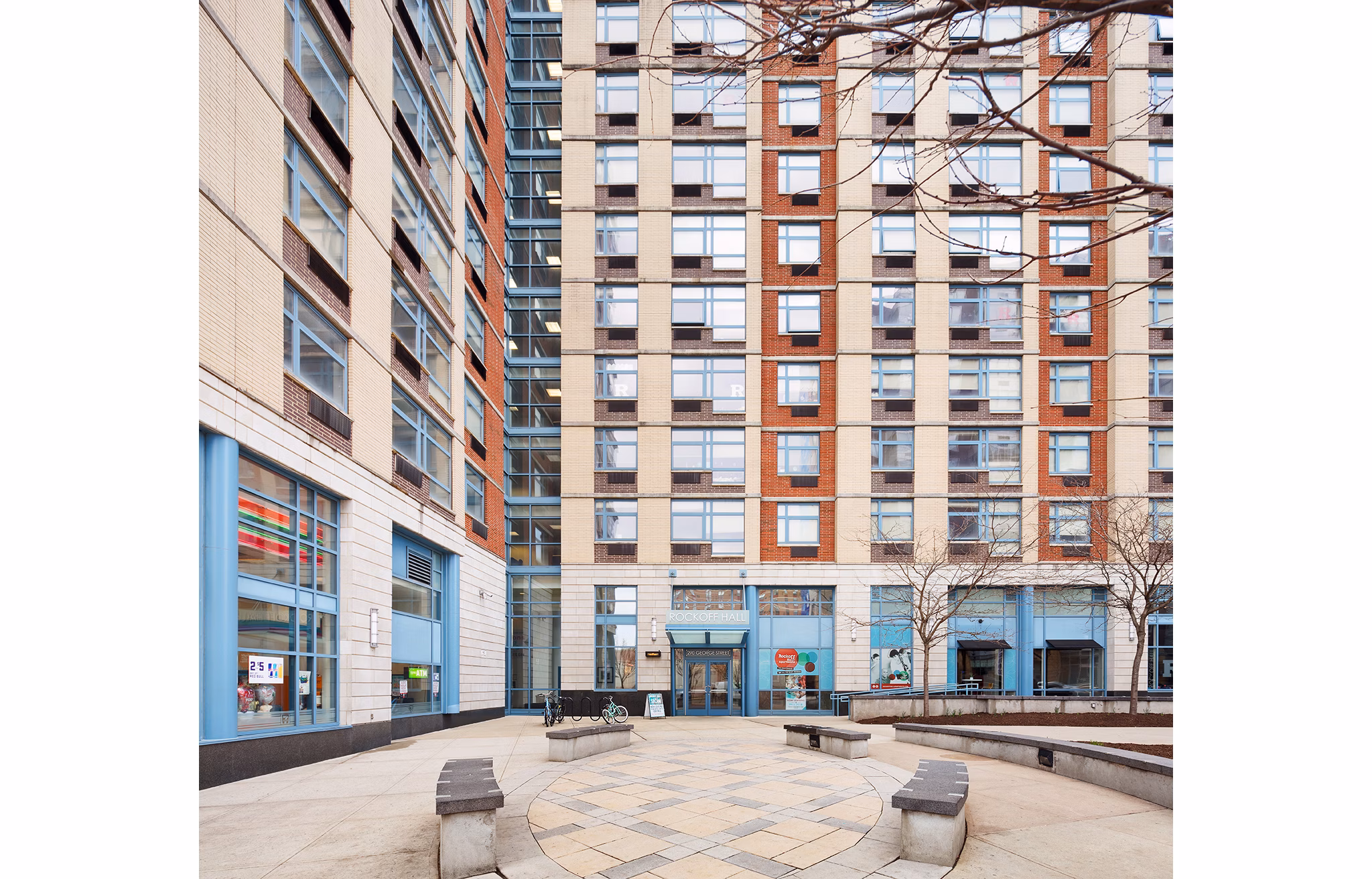 SoCam 290 Apartments: Modern courtyard with lush greenery and seating areas, perfect for relaxation and social gatherings