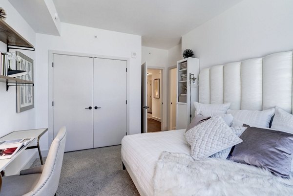 Exo Apartments: Modern bedroom with elegant decor at luxury apartments in vibrant urban location