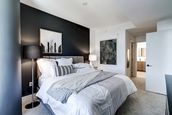 Bedroom featuring modern design and cozy atmosphere in Exo Apartments