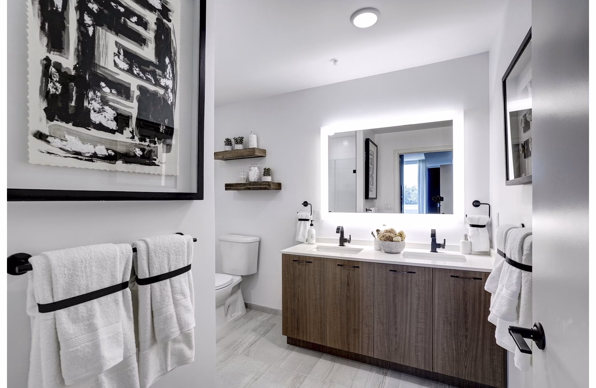 Bathroom featuring elegant fixtures and marble countertops in Exo Apartments, a Greystar luxury property