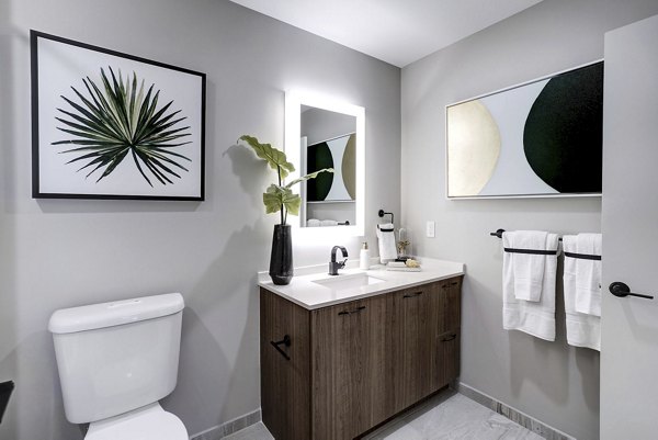 Modern bathroom with sleek fixtures in Exo Apartments, featuring contemporary design and luxury finishes for a premium living experience