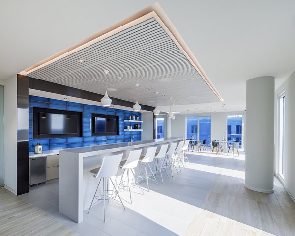 Modern clubhouse with stylish decor at Exo Apartments, offering luxury living and community spaces