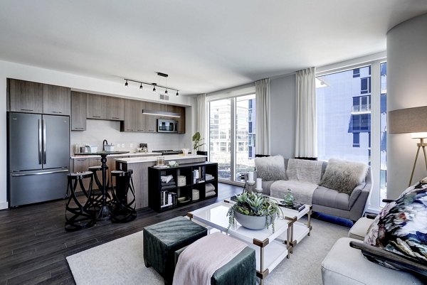 Spacious living room featuring modern decor in Exo Apartments, luxury residence