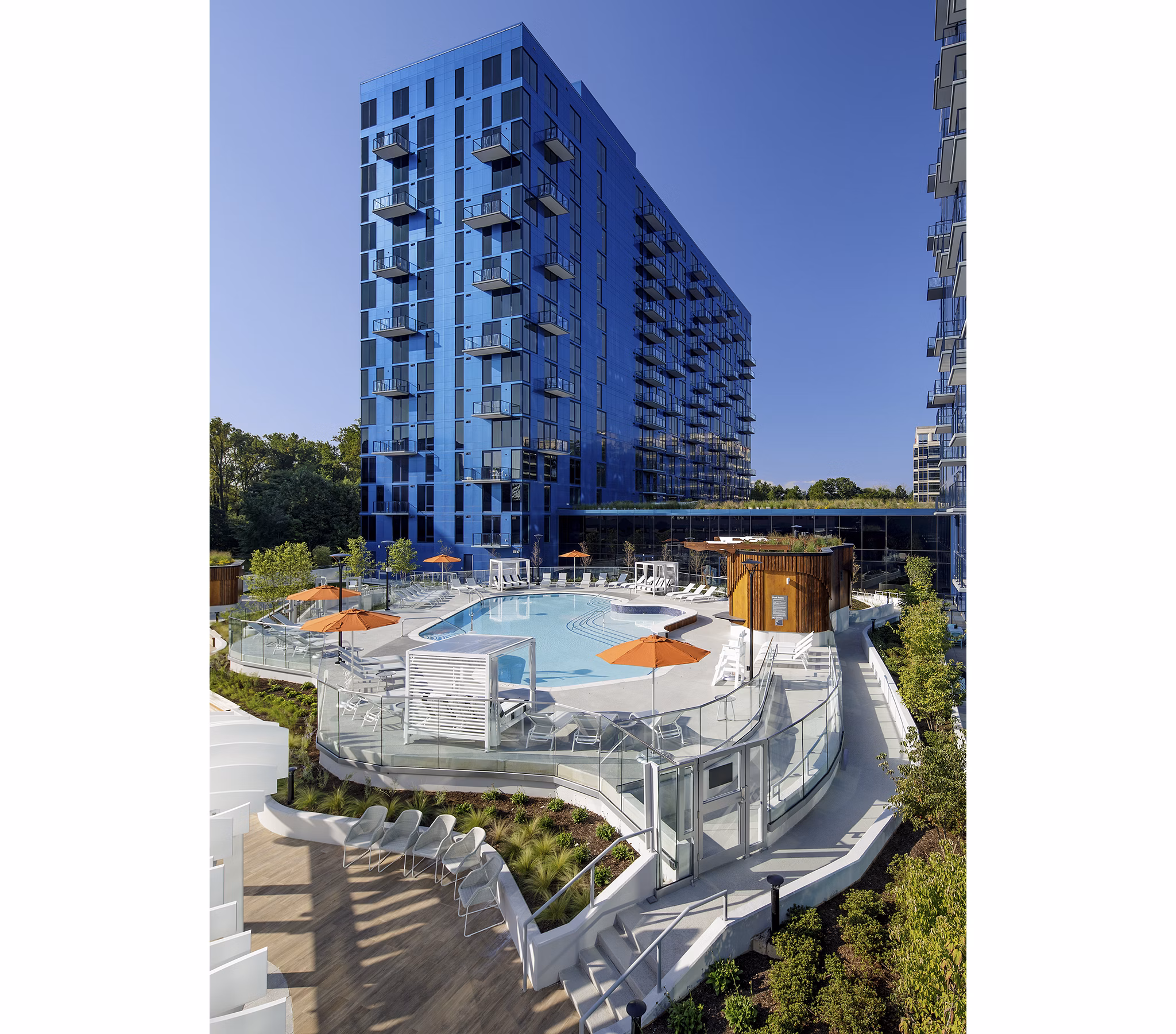Inviting rooftop pool at Exo Apartments with city skyline views