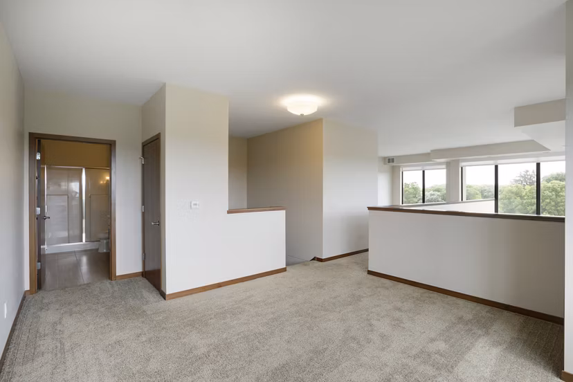 Spacious bedroom with modern decor at Ellipse on Excelsior luxury apartments