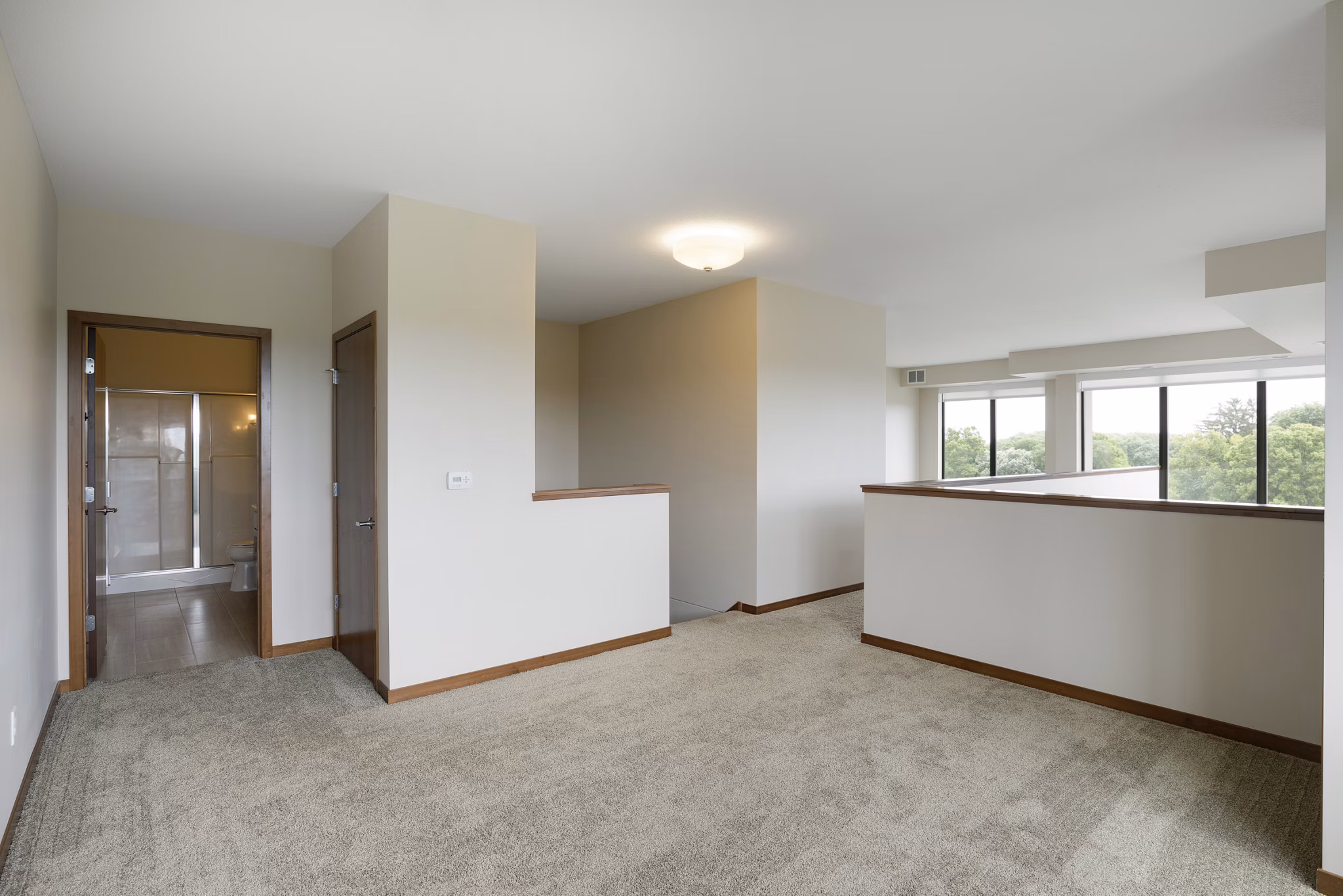Spacious bedroom with modern decor at Ellipse on Excelsior luxury apartments