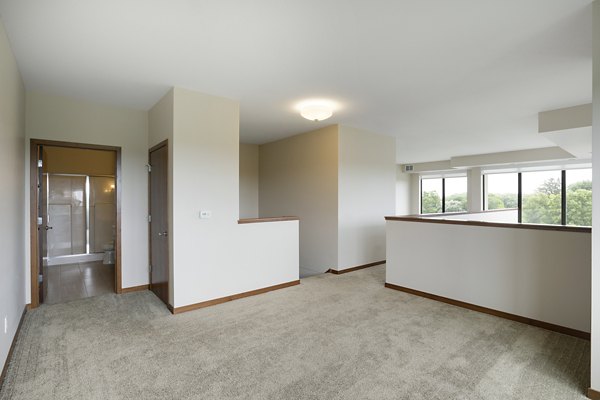 Spacious bedroom with modern decor at Ellipse on Excelsior luxury apartments