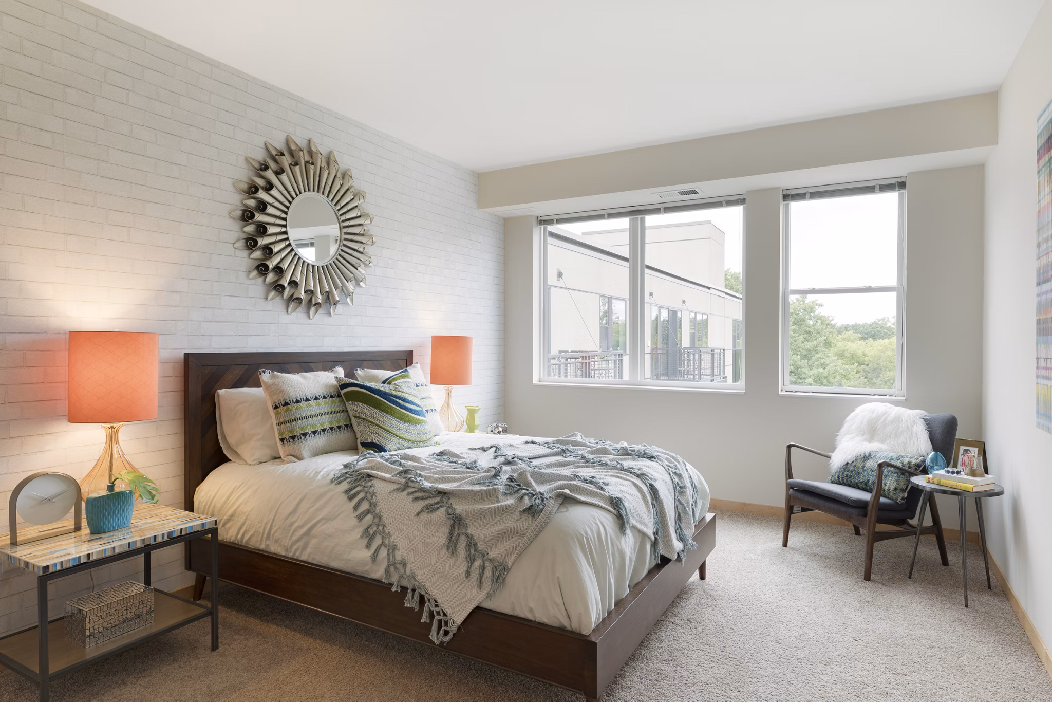 Spacious bedroom with modern decor and ample natural light at Ellipse on Excelsior luxury apartments