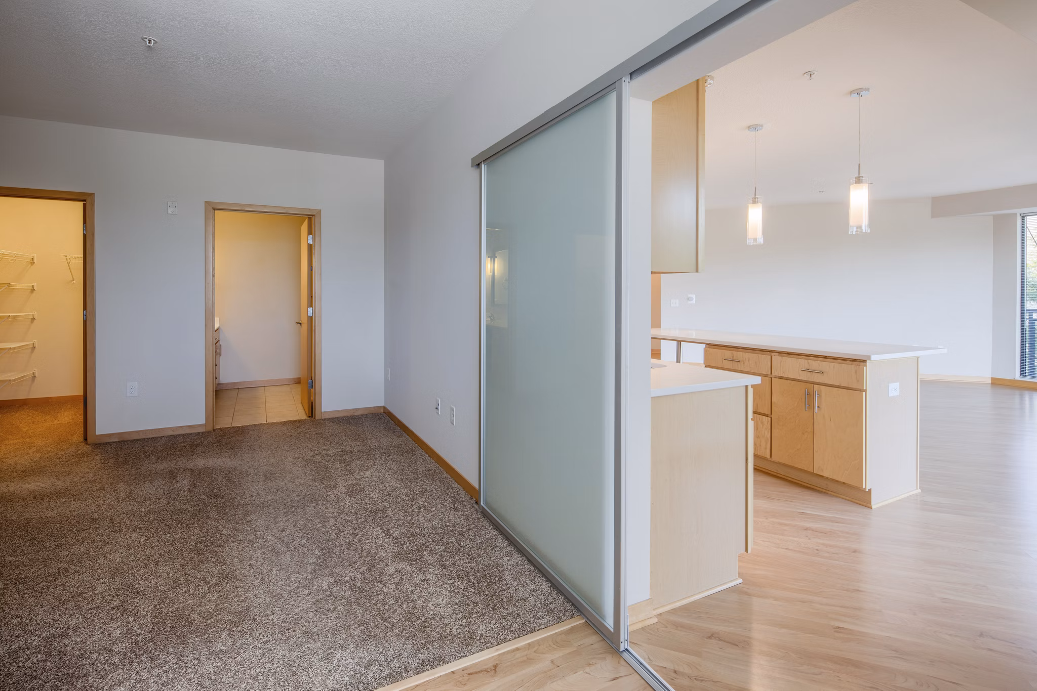 Cozy bedroom with modern decor at Ellipse on Excelsior luxury apartments