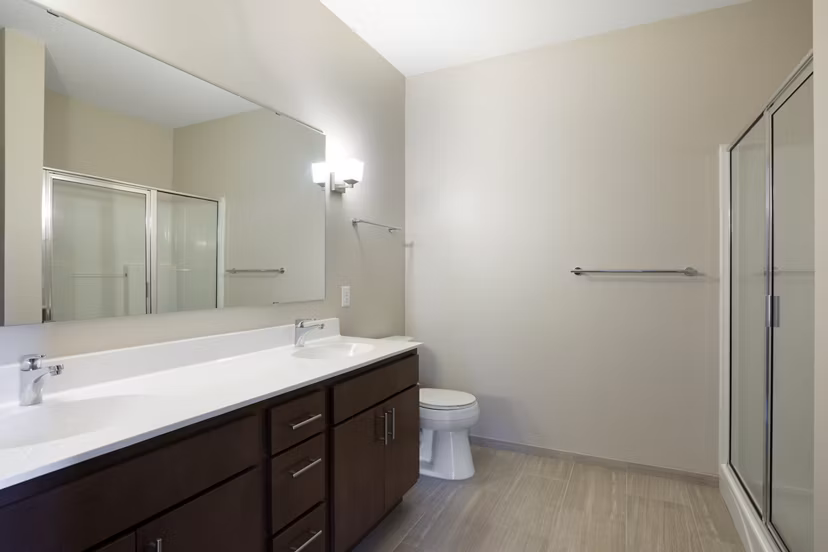 Modern bathroom with elegant fixtures and spacious layout in Ellipse on Excelsior luxury apartments