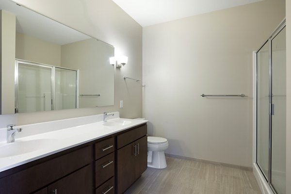 Modern bathroom with elegant fixtures and spacious layout in Ellipse on Excelsior luxury apartments