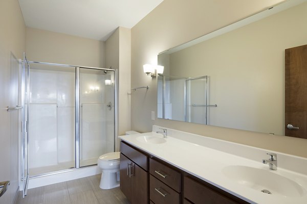 Modern bathroom featuring sleek fixtures at Ellipse on Excelsior luxury apartments