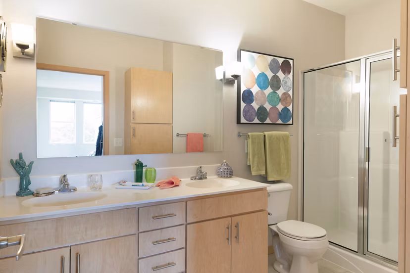Modern bathroom with sleek fixtures and marble countertops at Ellipse on Excelsior luxury apartments