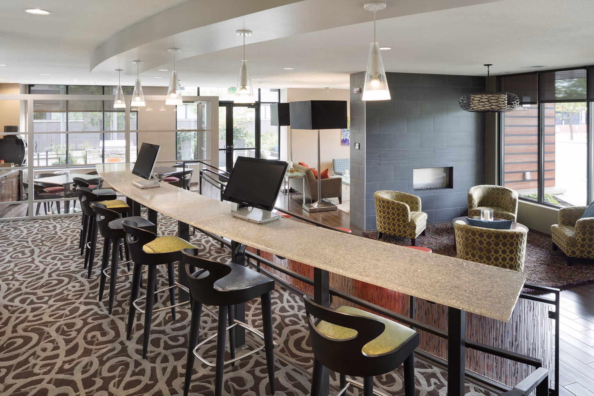 Modern clubhouse with stylish seating and lighting at Ellipse on Excelsior luxury apartments