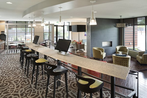 Modern clubhouse with stylish seating and lighting at Ellipse on Excelsior luxury apartments