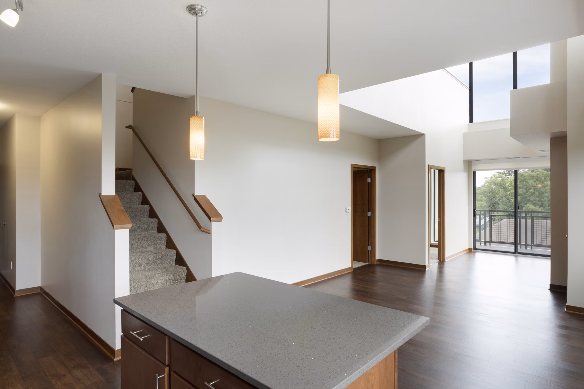 Dining room featuring modern dÃ©cor and elegant chandelier at Ellipse on Excelsior luxury apartments