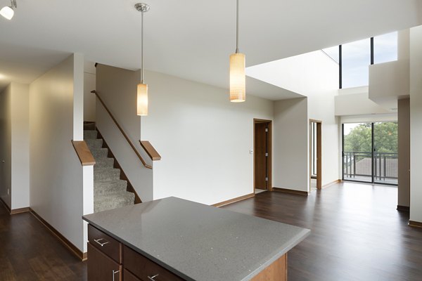 Dining room featuring modern dÃ©cor and elegant chandelier at Ellipse on Excelsior luxury apartments