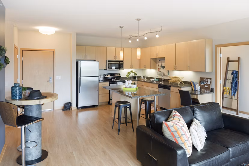 Modern kitchen with stainless steel appliances at Ellipse on Excelsior luxury apartments