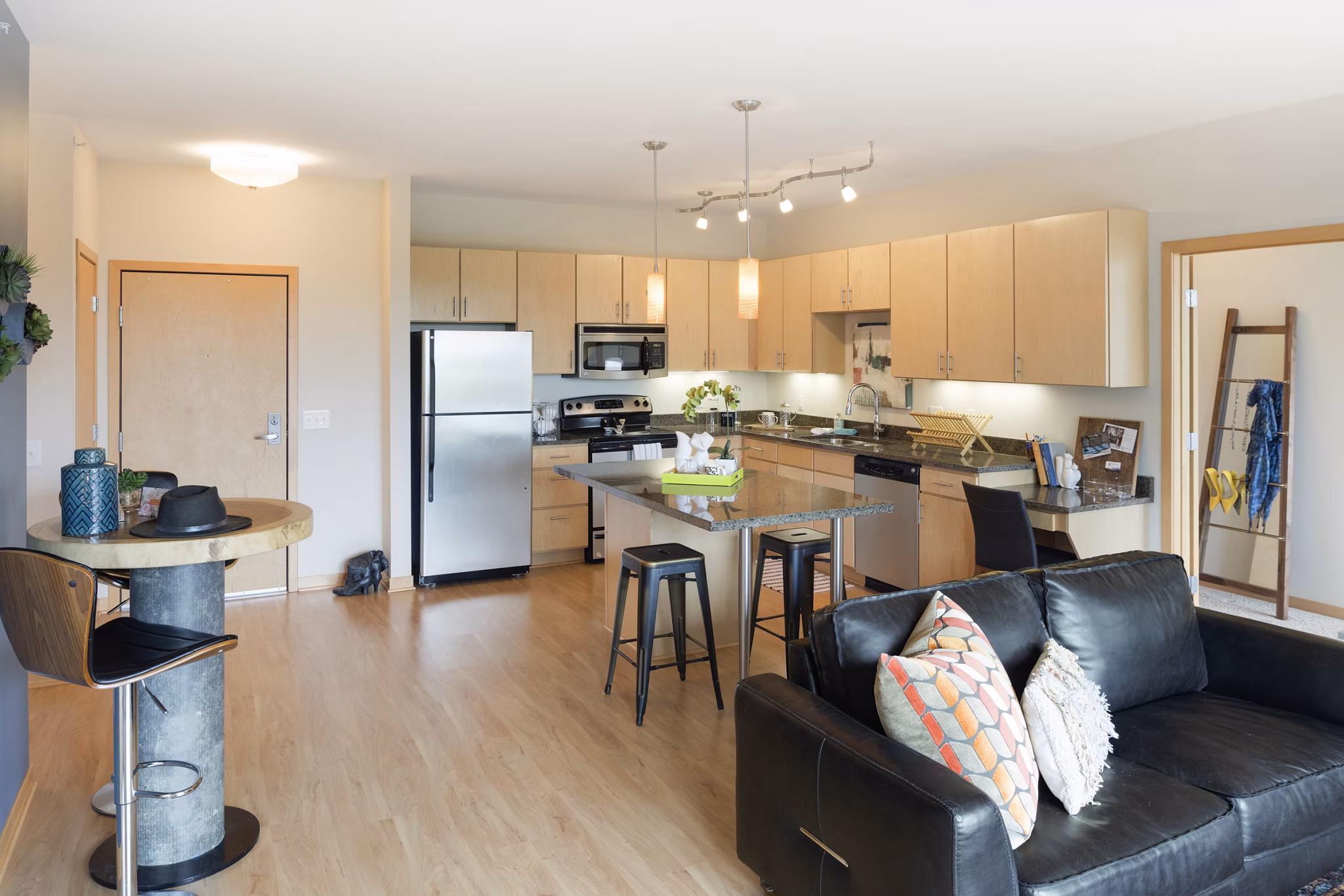Modern kitchen with stainless steel appliances at Ellipse on Excelsior luxury apartments