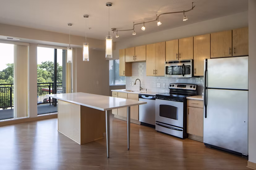 Modern kitchen with stainless steel appliances at Ellipse on Excelsior