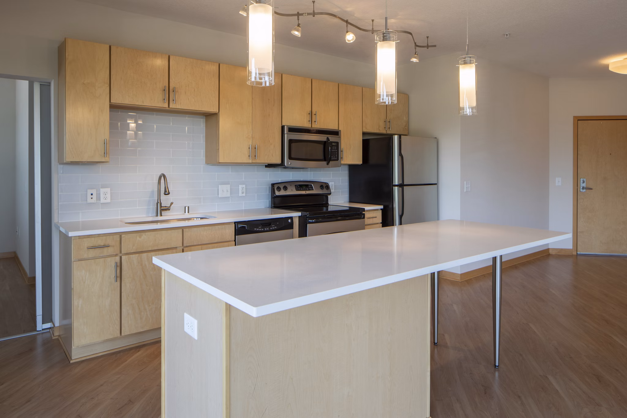 Ellipse on Excelsior: Modern kitchen with stainless steel appliances and sleek countertops in luxury apartments