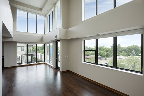 Stylish living room with contemporary furnishings at Ellipse on Excelsior luxury apartments