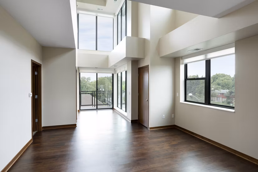 Ellipse on Excelsior: Sunlit living room with modern furnishings and stylish decor