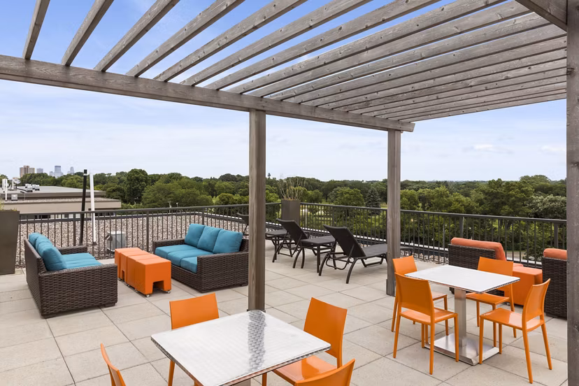 Patio area with stylish seating at Ellipse on Excelsior, a Greystar luxury apartment community