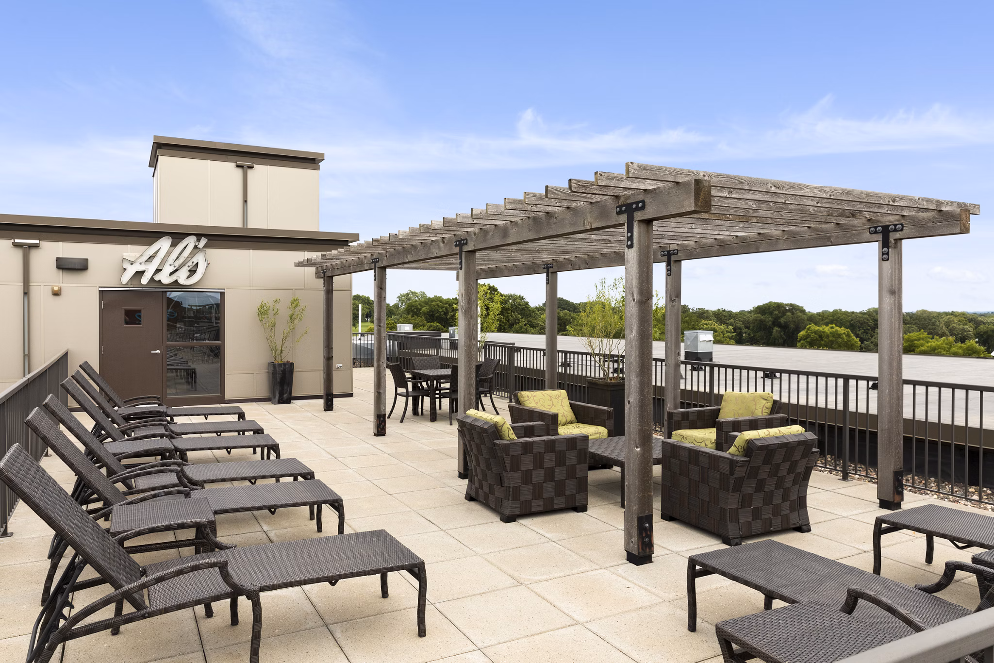 Outdoor patio with seating and garden view at Ellipse on Excelsior luxury apartments