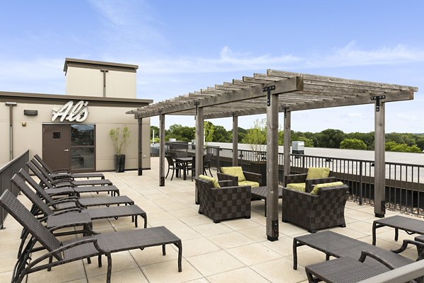 Outdoor patio with seating and garden view at Ellipse on Excelsior luxury apartments