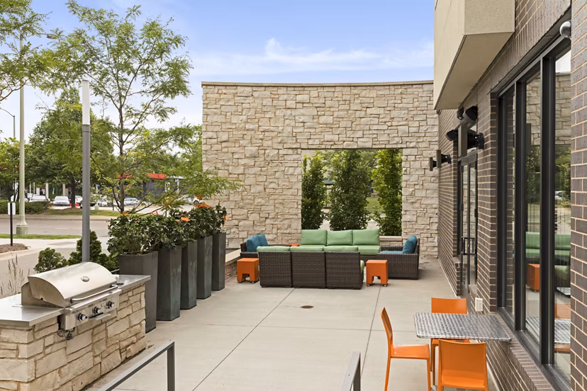 Outdoor grill area with modern seating at Ellipse on Excelsior Luxury Apartments, a Greystar property in vibrant downtown Minneapolis