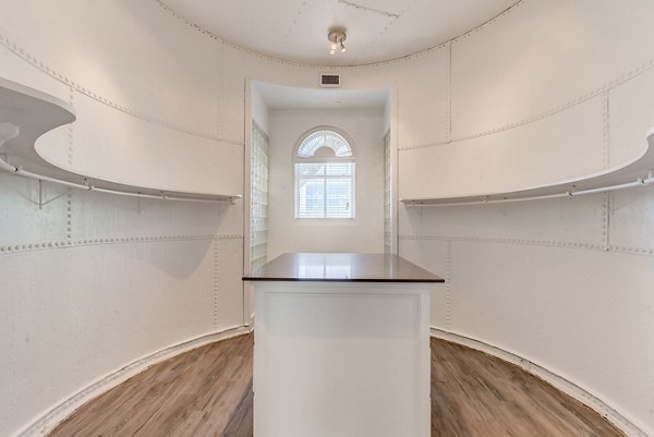 Walk-in closet with ample shelving at Historic Electric Building Apartments
