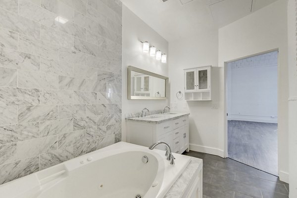 Elegant bathroom with vintage fixtures at Historic Electric Building Apartments