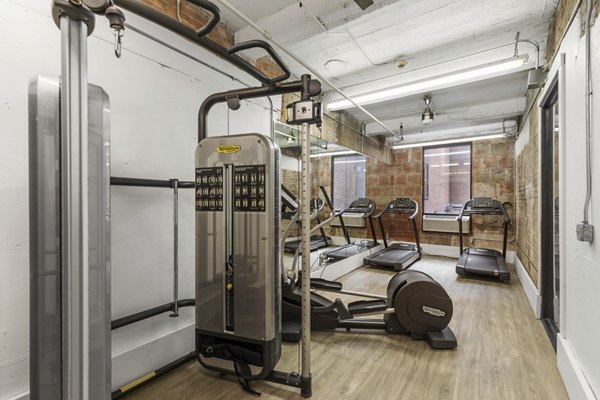 State-of-the-art fitness center at Historic Electric Building Apartments with modern equipment and ample workout space