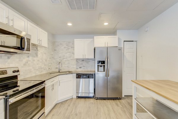 Spacious kitchen with modern appliances in Historic Electric Building Apartments