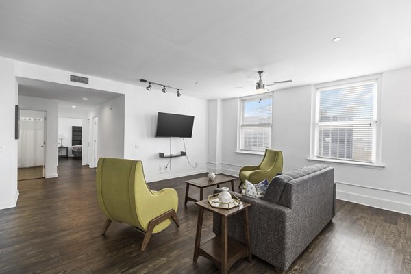 Spacious living room with modern decor in Historic Electric Building Apartments