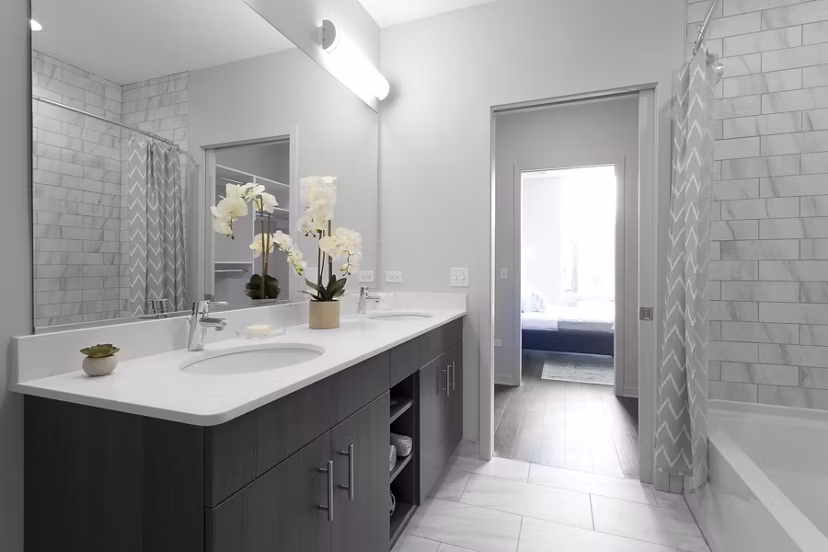 Luxurious bathroom with modern fixtures at Luxe on Chicago Apartments