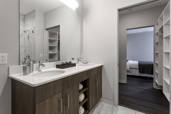 Luxurious bathroom with modern fixtures at Luxe on Chicago Apartments