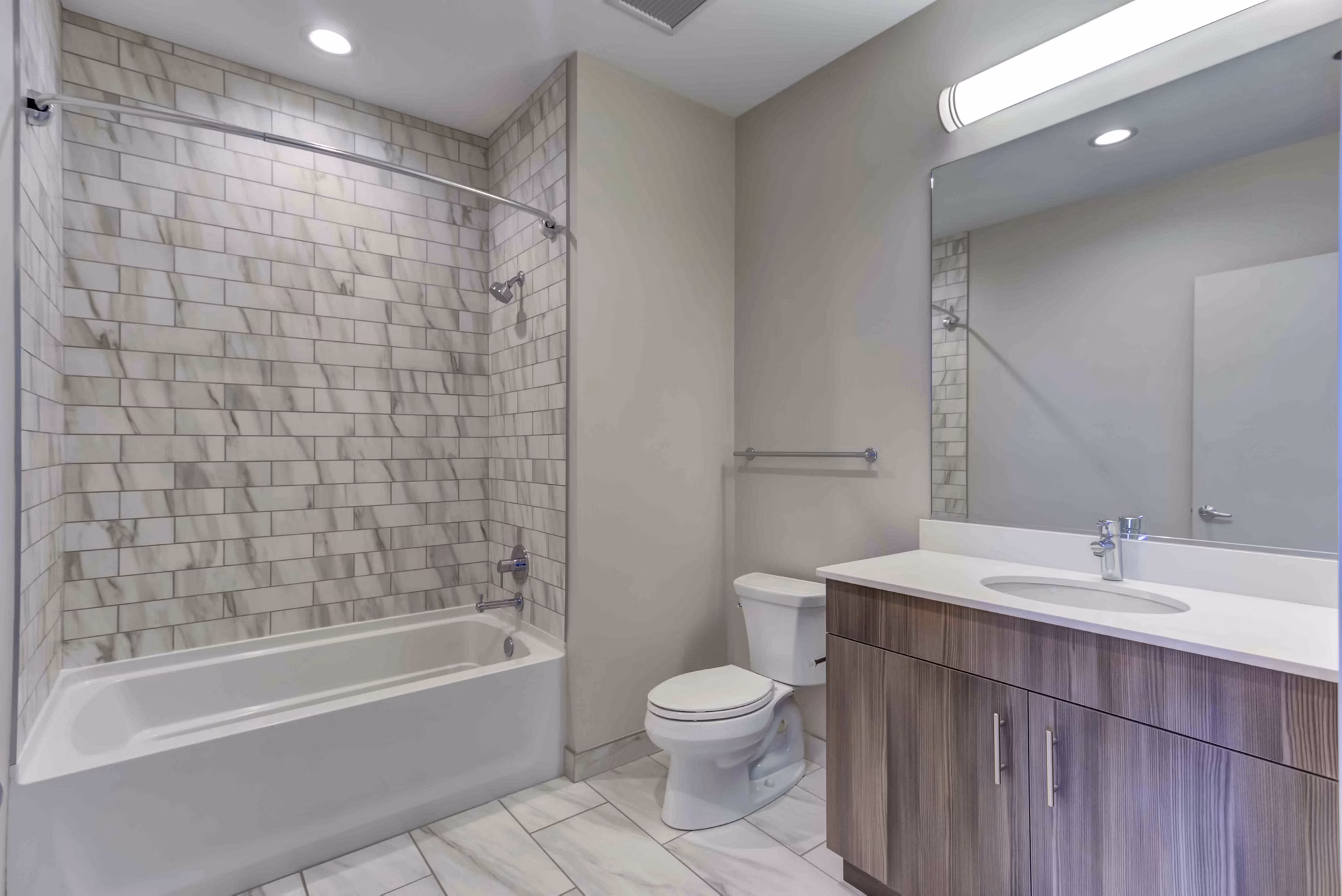 Bathroom featuring sleek fixtures and modern design at Luxe on Chicago Apartments