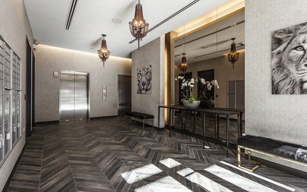 Clubhouse with modern design and comfortable seating at Luxe on Chicago Apartments