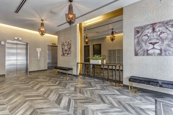 Clubhouse with modern design and plush seating at Luxe on Chicago Apartments