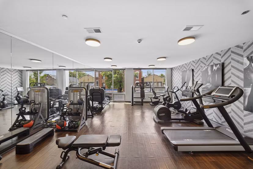 Fitness center featuring state-of-the-art equipment at Luxe on Chicago Apartments