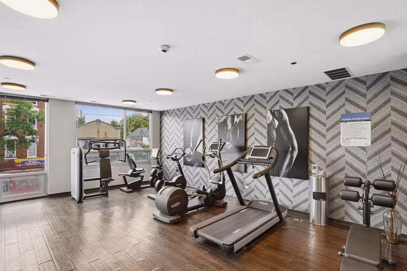 State-of-the-art fitness center at Luxe on Chicago Apartments offering modern exercise equipment and space