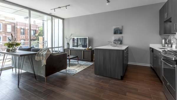 Spacious living room with modern furnishings in Luxe on Chicago Apartments